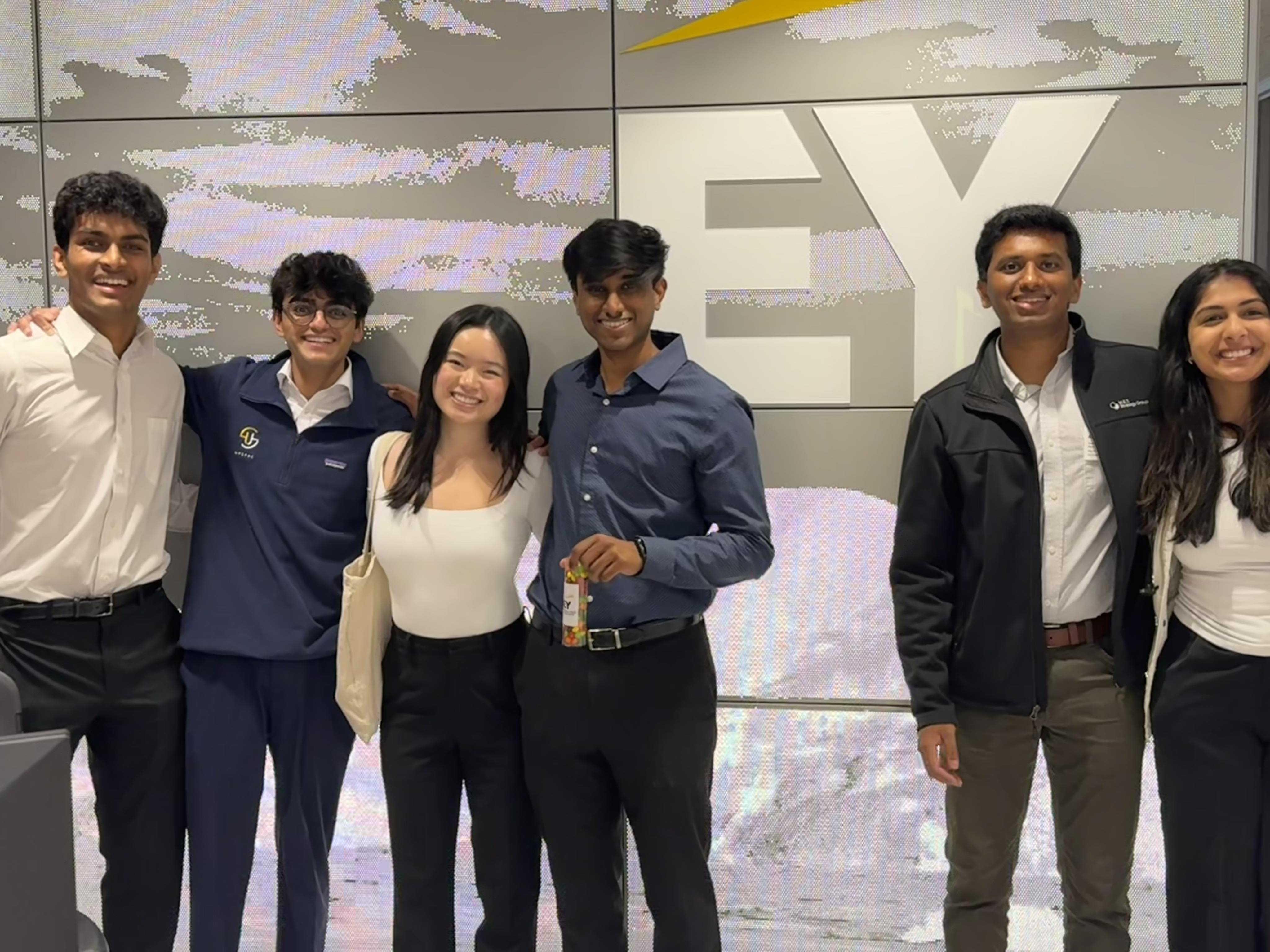 Berkeley team in front of EY sign